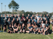 Female soccer team at Pensacola FC practicing on the field.