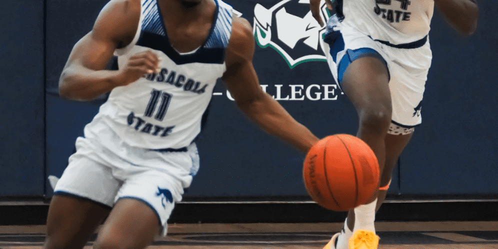 Pensacola State College basketball players in action during a game.