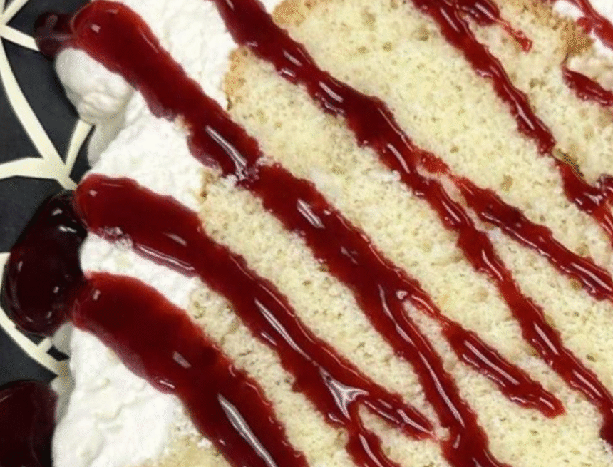 Lemon Chiffon Cake with Whipped Cream and Blackberry Glaze