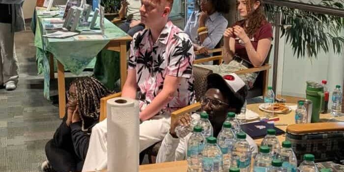 Open Mic Night at eCorsair Students participating in Open Mic Night at eCorsair, showcasing talent in a lively campus event.