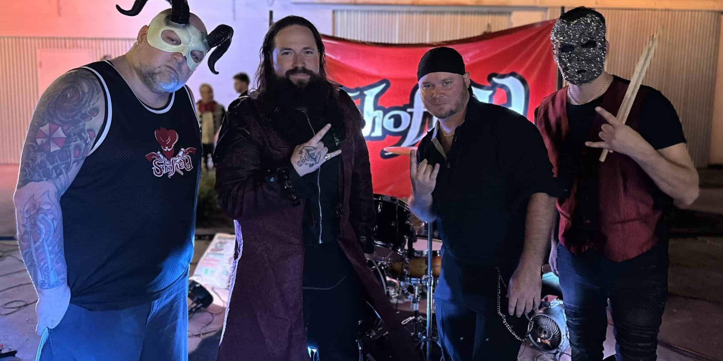 Group of performers at Vampire Ball event with dark costumes and masks.