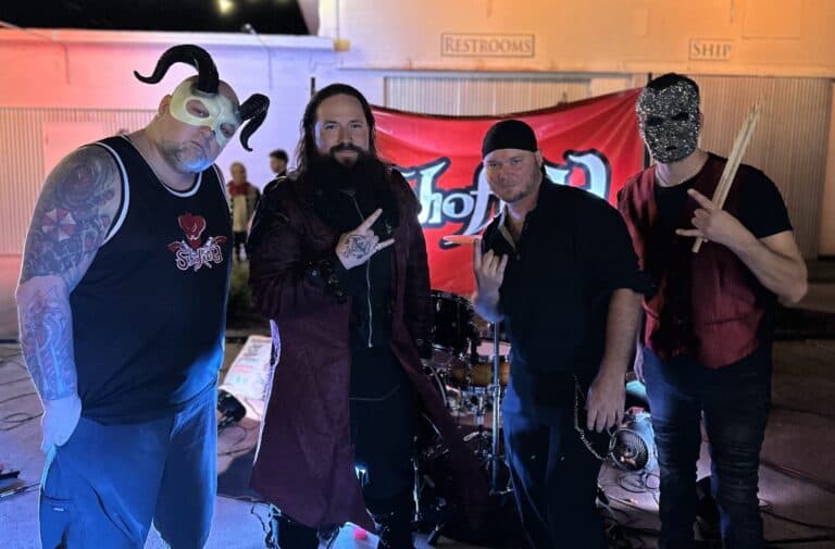 Group of performers at Vampire Ball event with dark costumes and masks.