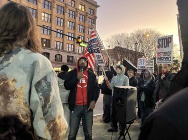 Decorative image of Pensacola ICE protest.
